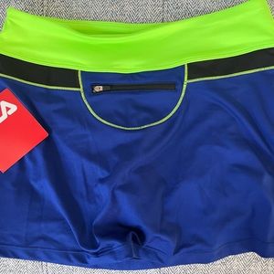 Woman’s Fila skort with a key zipper pocket in the back.
